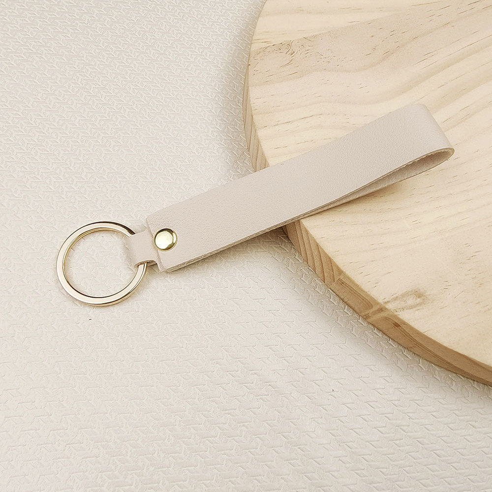 Llavero de mano cuero sintetico blanco marfil