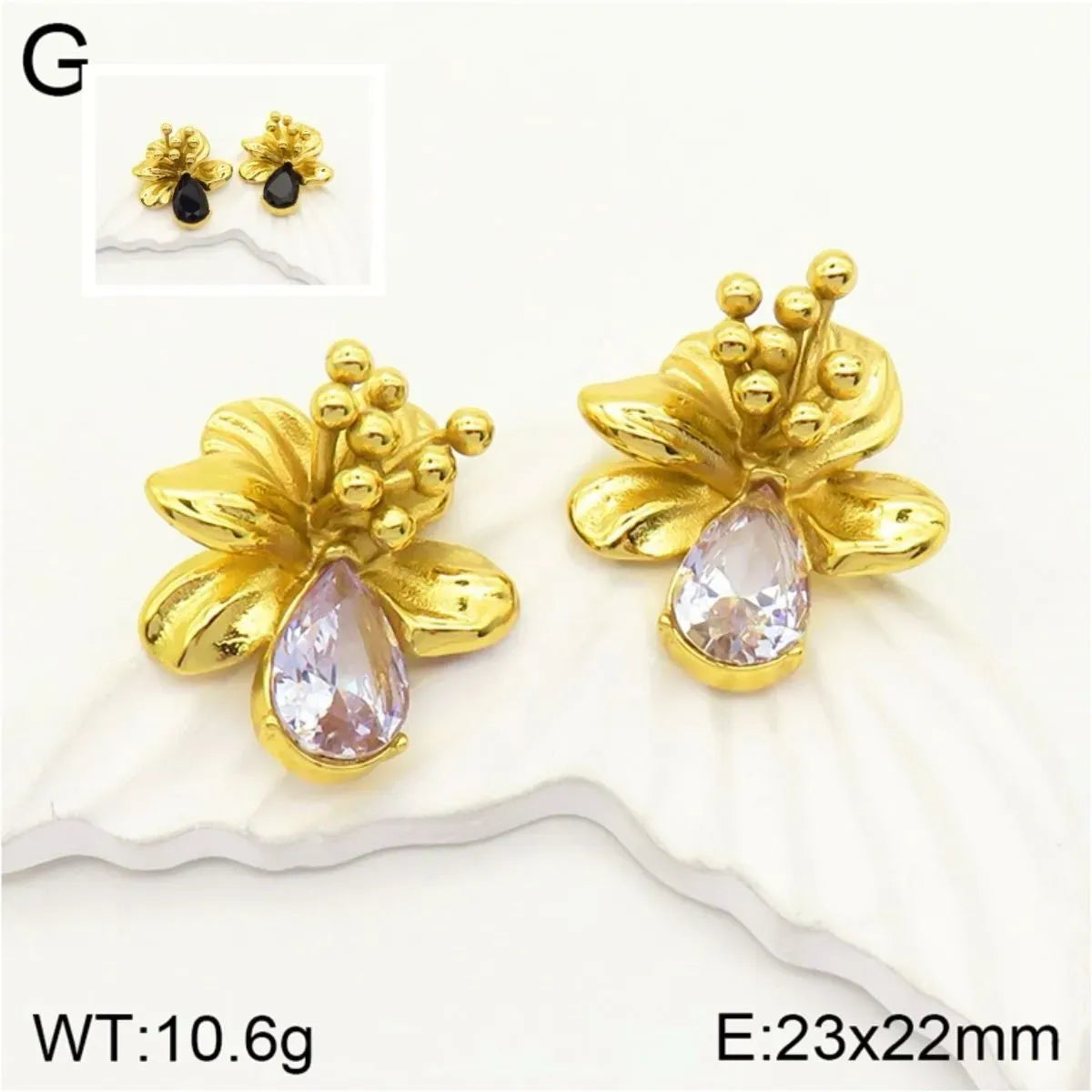Arete flor dorado con piedra clear. Materia: Acero inoxidable 304 enchapado en oro de 18K